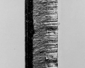 Black and white image of the edge of a bimetallic strip, taken using a Cognex 7402 camera.